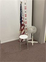 Holmes Fan, plastic stool, and American Flag
