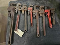7 PIPE WRENCHES AND A MONKEY WRENCH
