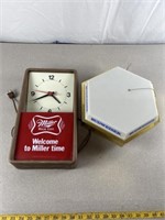 Miller highlife clock and Budweiser light. Both