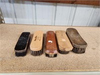 Five assorted shoe shine brushes