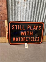 STILL PLAYS WITH MOTORCYCLES METAL SIGN, 12X18"