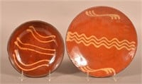 Two Yellow Slip-Decorated Redware Plates.