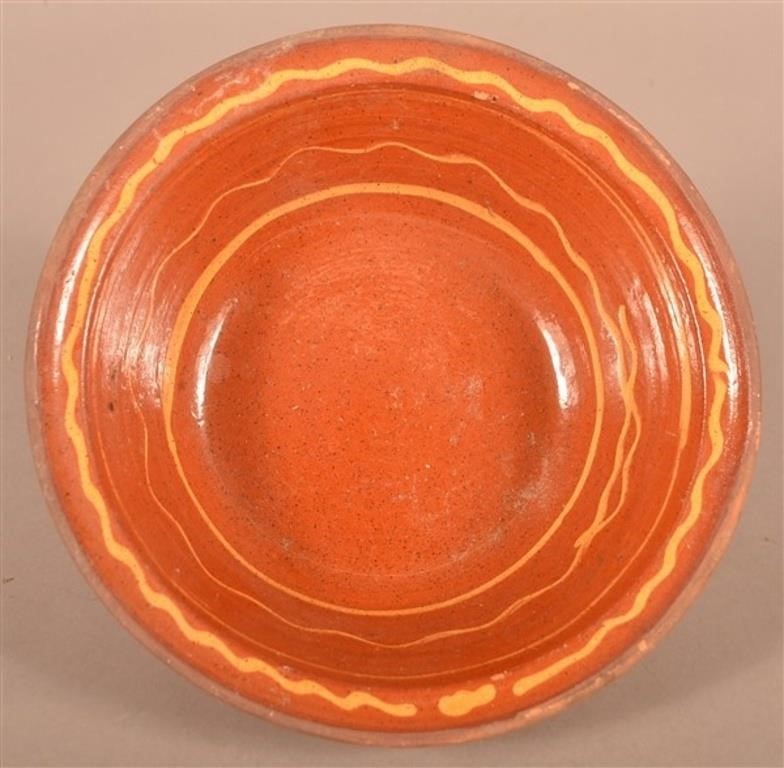 19th C. Redware Bowl with Yellow Slip Decoration.