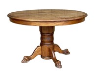 Round top oak pedestal extension table with no