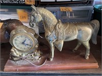 United electric mantle clock featuring a horse