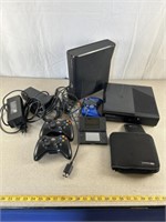 Two Xbox 360s with controllers and power