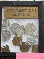 Railroad Tags and Coins in Display Case.