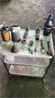 Gear oil, oil cans and crescent wrench