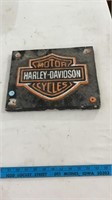Cast iron Harley Davidson sign.