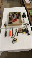 Various tools, tape measure, hammer, aluminum