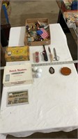 Empty cigar boxes, post card, key chains
