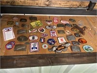 Patches and belt buckles