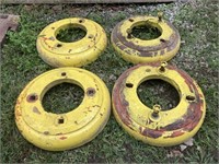 4 yellow tractor weights