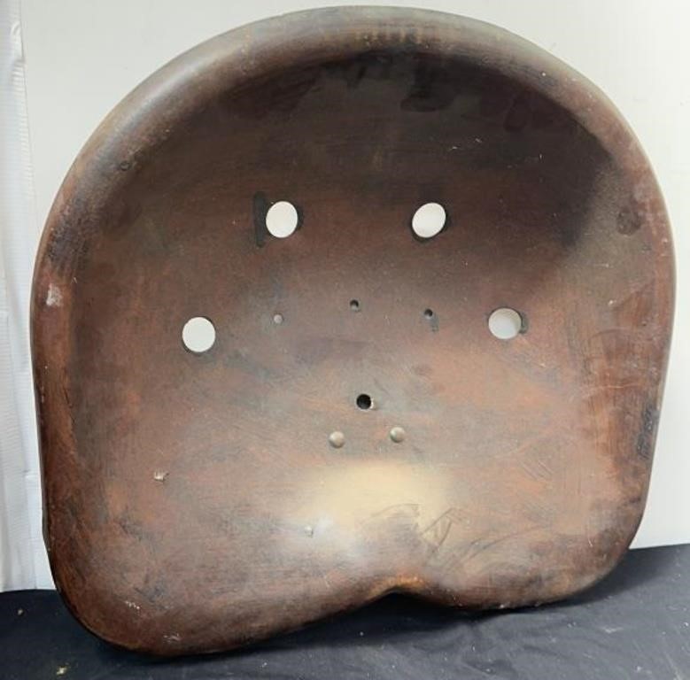 Vintage metal tractor seat