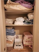 Contents of Linen Closet.  Several Towels, Used