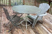 Wrought iron table with glass top, two iron