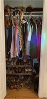 Closet full of men’s clothing, belts, shoes and