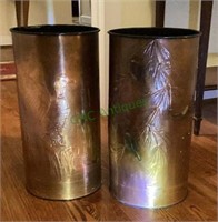 Two hammered copper waste baskets with plastic