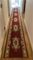 Very long hall rug measures 26 1/2 inches wide