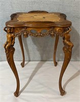Vintage heavily carved wooden parlor table -