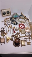 Assorted jewelry, pins, belt buckles, some