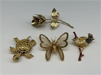 Set of 4 Gold Tone Brooches.