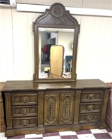9  drawer dresser with an attached mirror