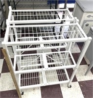 2 small, portable pulled up shelving units