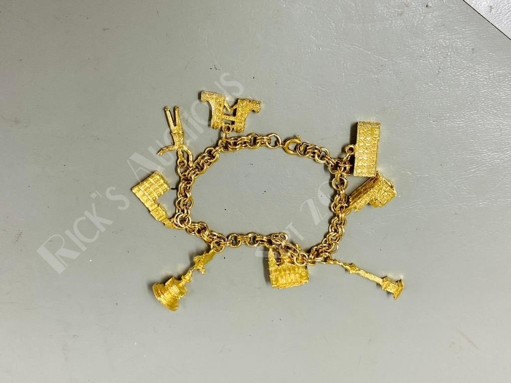 gold plated charm bracelet w/ building charms
