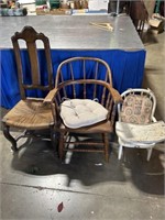 Two wood chairs and small wood highchair