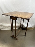 Wooden folding end table. In largest form 26 x 24