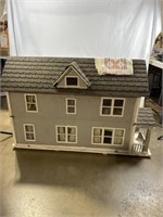 Wooden dollhouse. Approximately 50 inches long