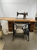 Singer sewing table and sewing machine.