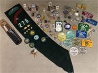 Pins, buttons and girl scout sash