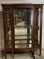 WALNUT BOWED GLASS CURIO CABINET ON TAPERED LEGS