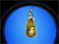 Sterling and amber pendent about 3 1/2 inches