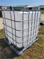 300 Gallon  poly tank in a galvanized pallet cage;