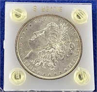 1882 Morgan silver dollar in case  Edge toneing