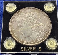 1900-O Morgan silver dollar in case  Edge toneing