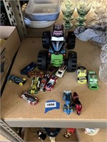 lot of large grave digger truck and other small