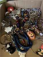 kids tray of jewelry and pins