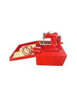 RED IN SELF CONTAINED BOX CHILD'S SEWING MACHINE
