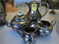 Four-piece electroplated tea set with spoons.