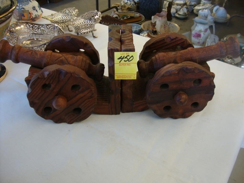 Rustic wooden carved pair of cannon book ends.