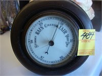 Edwardian brown wooden round barometer.