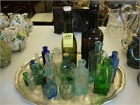 Various old glass bottles including a green