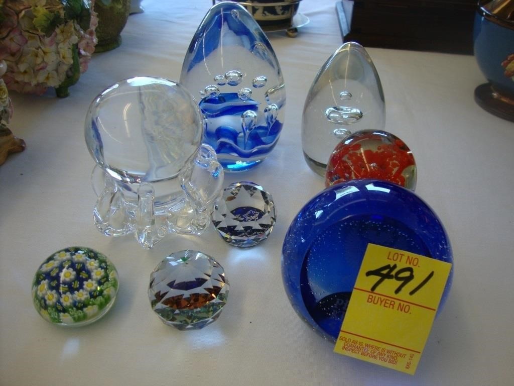 Eight art glass paperweights.