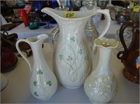 Two Irish Belleek pitchers along with a vase,