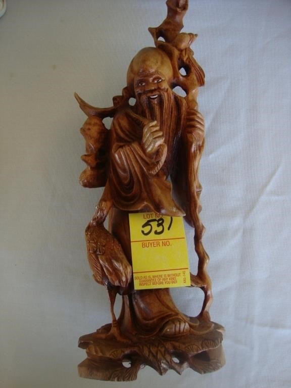 10" wooded Oriental carving of a god.