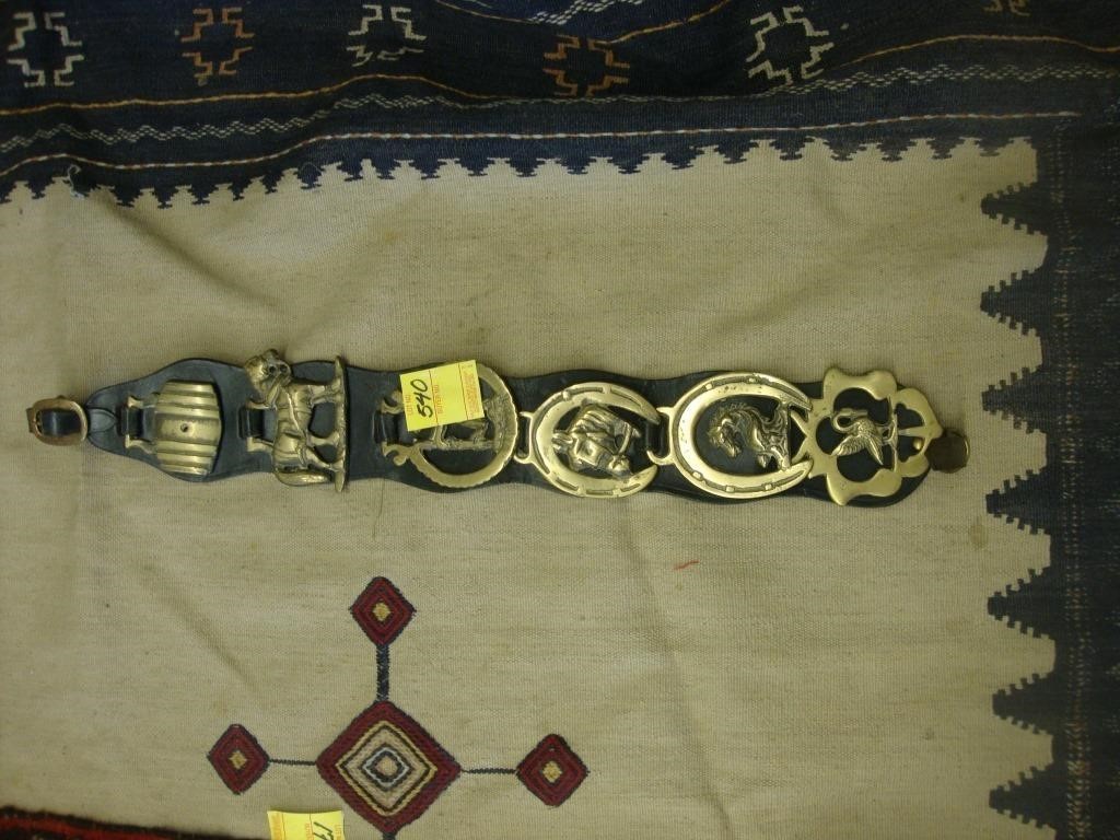 Leather strap containing 6 horse brasses, 23".